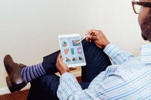 Man using tablet Maple Grove Eye Doctors at Pearle Vision