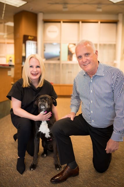 Jim and Donna Hawley with Boxer, Rocky, Owners of Maple Grove Eye Doctors at Pearle Vision