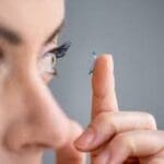 woman with contact lens Maple Grove Eye Doctors at Pearle Vision