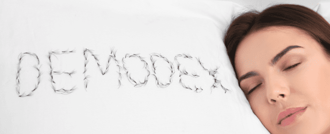 Person resting with closed eyes on pillow with eyelashes arranged to spell Maple Grove Eye Doctors at Pearle Vision